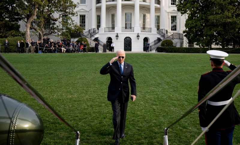 False: This image of Biden leaving for Europe is fake, as the trees in the background would not have been in full foliage on the day it was taken.