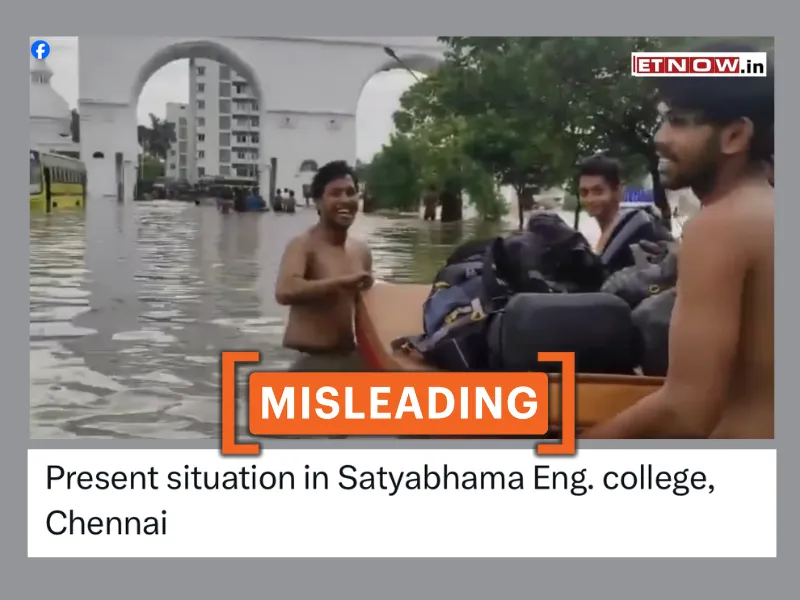 A screenshot from the viral video shows young men wading through chest-deep water, carrying their luggage as they navigate the flooded area.