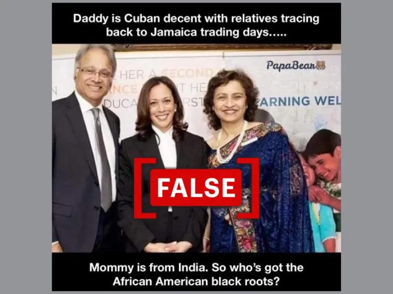 A screenshot of the social media image showing U.S. Vice President Kamala Harris standing in between a man in a suit and a woman in a saree, used to claim it shows her parents.