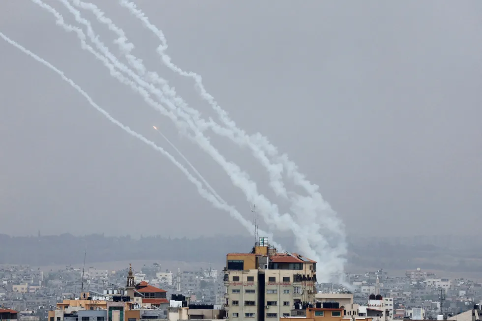 Rockets are fired from Gaza towards Israel, in Gaza, October 9, 2023.