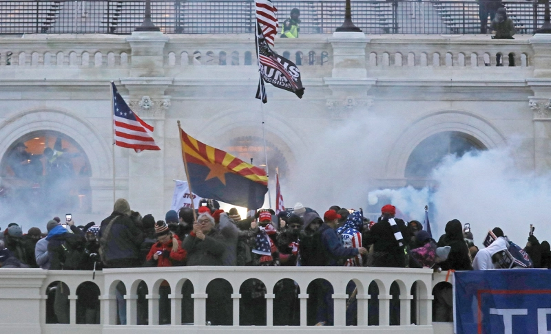 False: Kevin Seefreid, who held the confederate flag during the Capitol insurrection, is a Biden supporter.